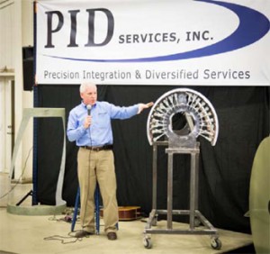 Scott Slusher, president and CEO of Precision Integration & Diversified Services Inc., talks about the parts produced by the Lufkin business, which employs more than 60 people at its facility on Southpark Drive.